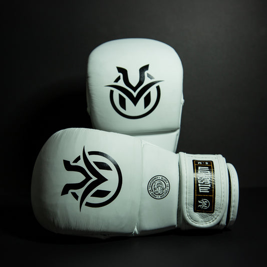 White MMA sparring gloves with black logos on a dark background